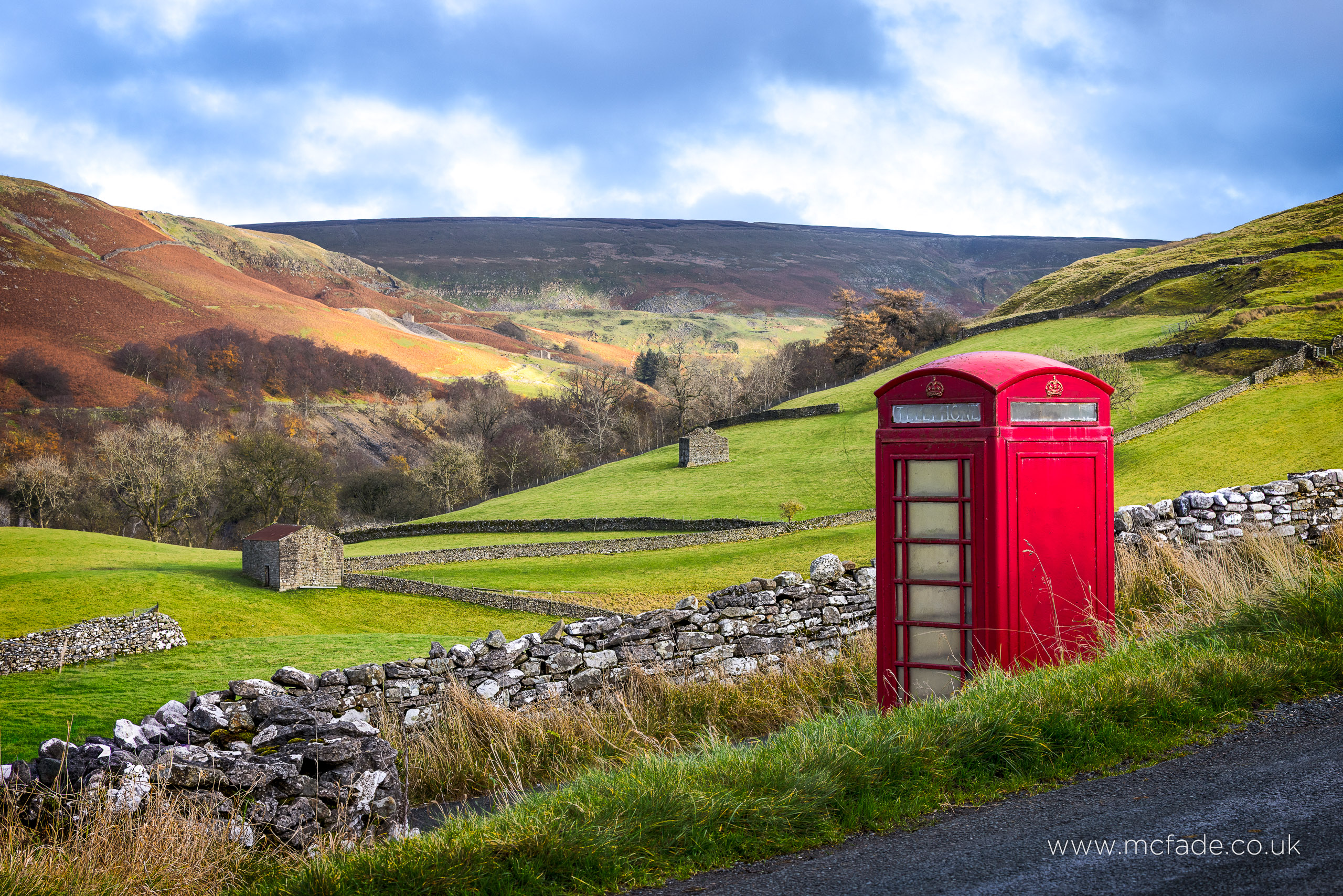 Red telephone boxes in the Swaledale landscape